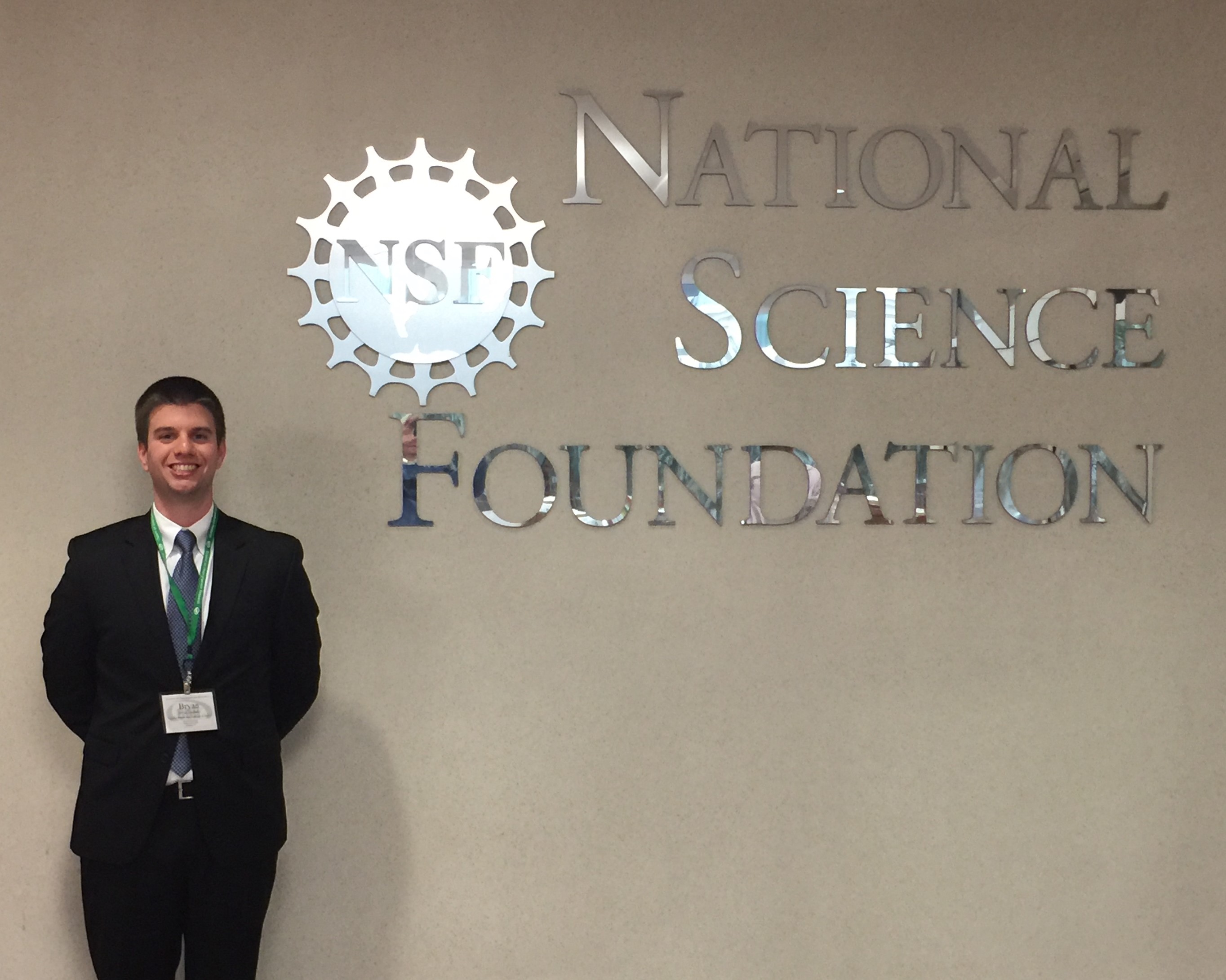 Bryan Faulkner with the NSF Logo